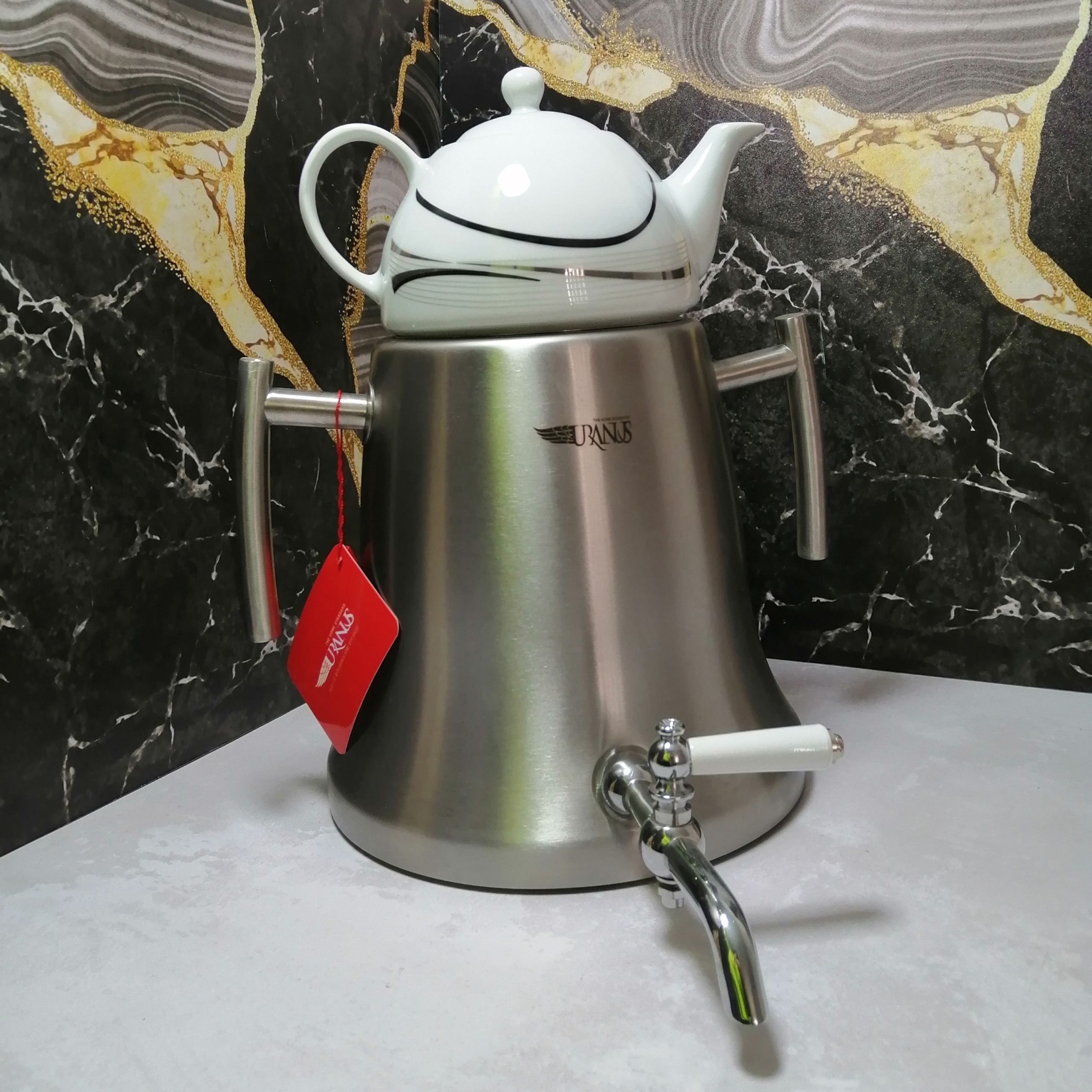 reC9iN8zsaJj7O7HfvVSekcfwnnzvo6SnR3BCcE9c2n3Ldsd4V کتری قوری رو گازی جاسمینورا مدل هرمی استیل - Image 1